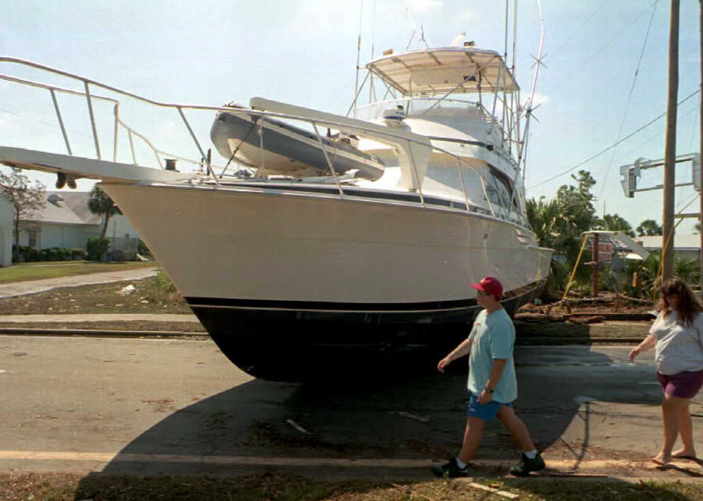 Two people walk around a yacht on Highway 98 in Ft. Walton Beach.