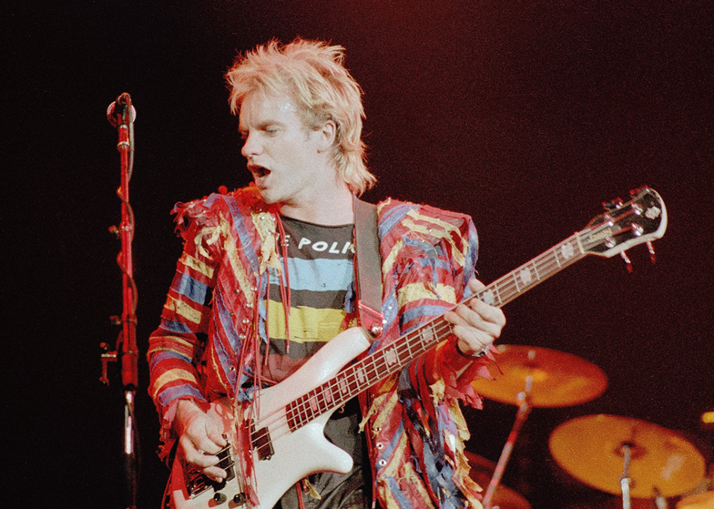 Sting performing with guitar.