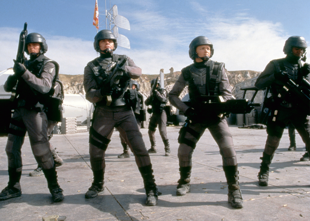Casper Van Dien, Dina Meyer, and Michael Ironside on the set of ‘Starship Troopers’.