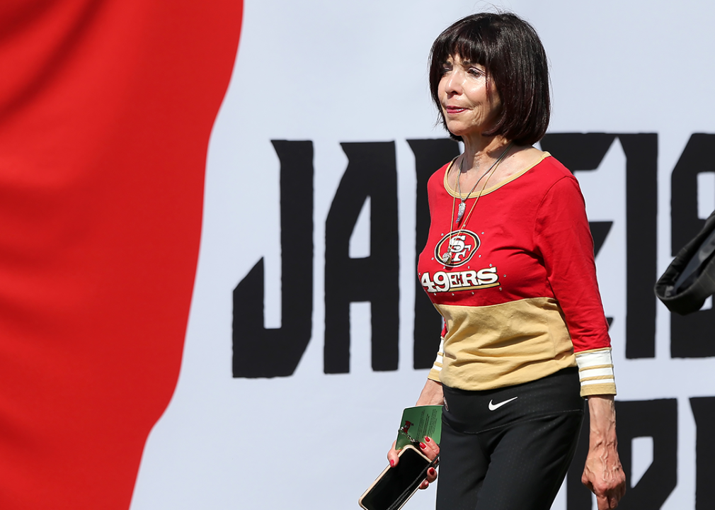 Denise DeBartolo York walks across the field at Raymond James Stadium in Tampa.