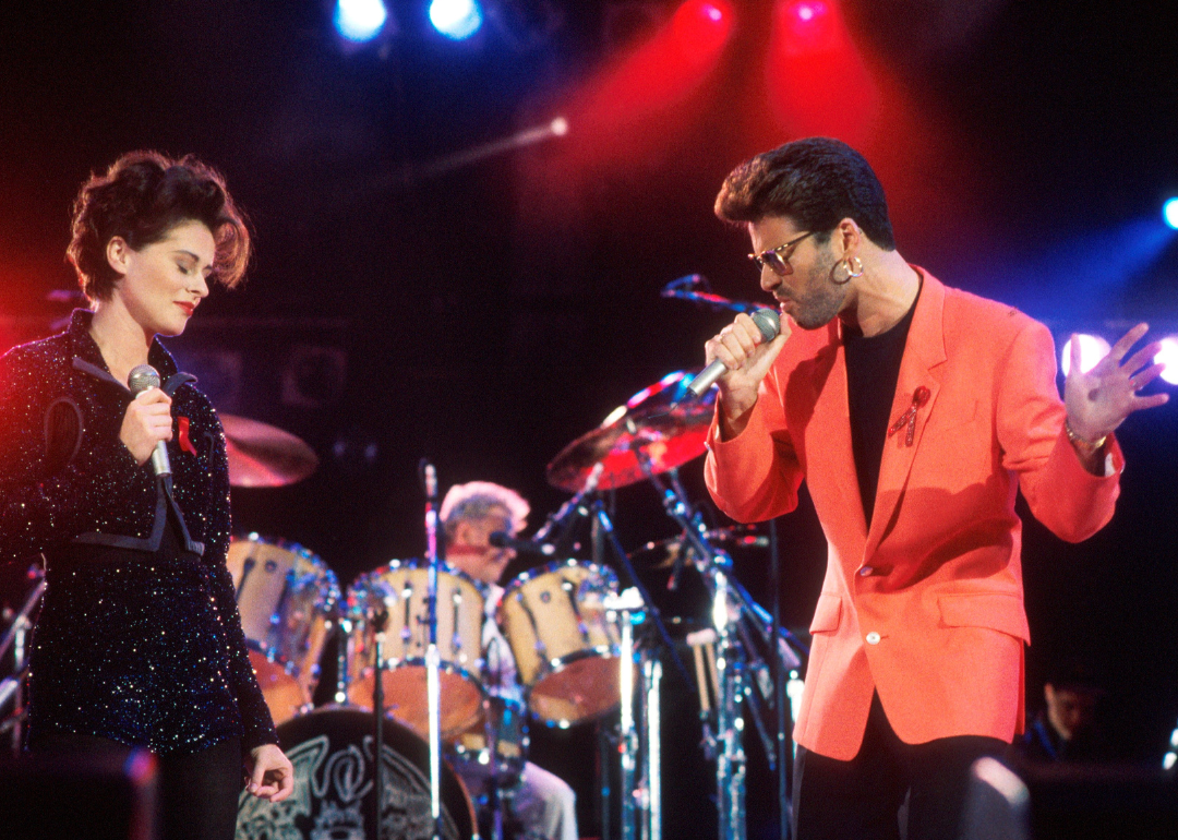 Lisa Stansfield, George Michael, and Roger Taylor perform at the Freddie Mercury Tribute Concert.