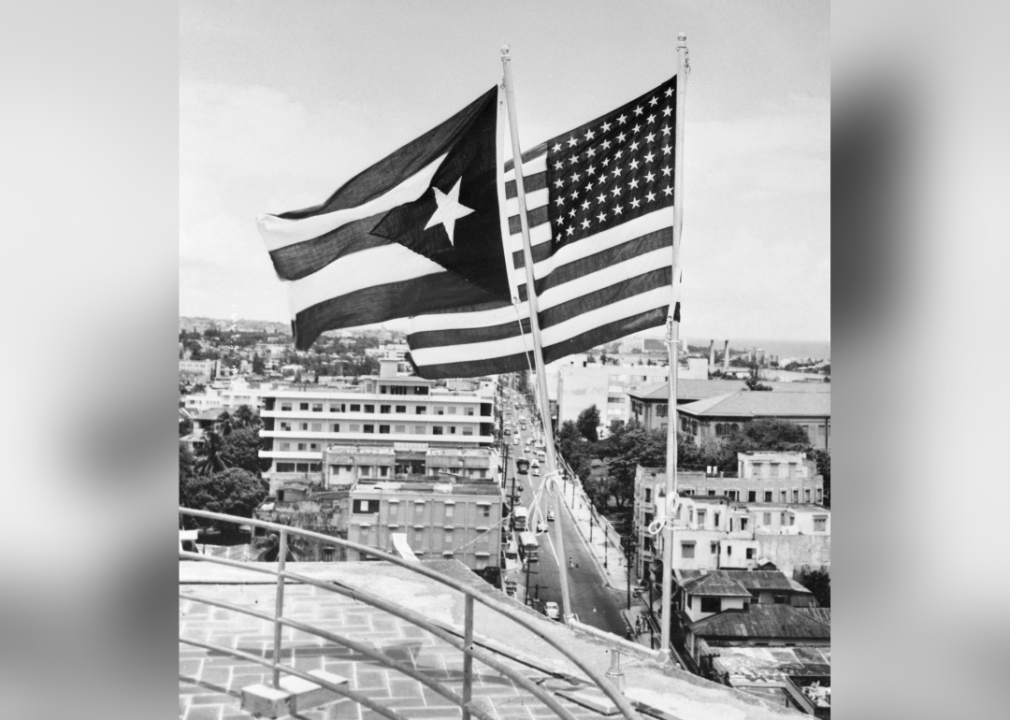 Puerto Rico and American flags fly over San Juan
