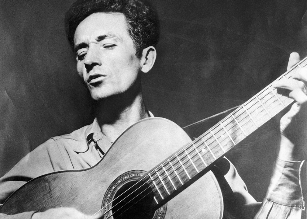 Woody Guthrie playing the guitar.