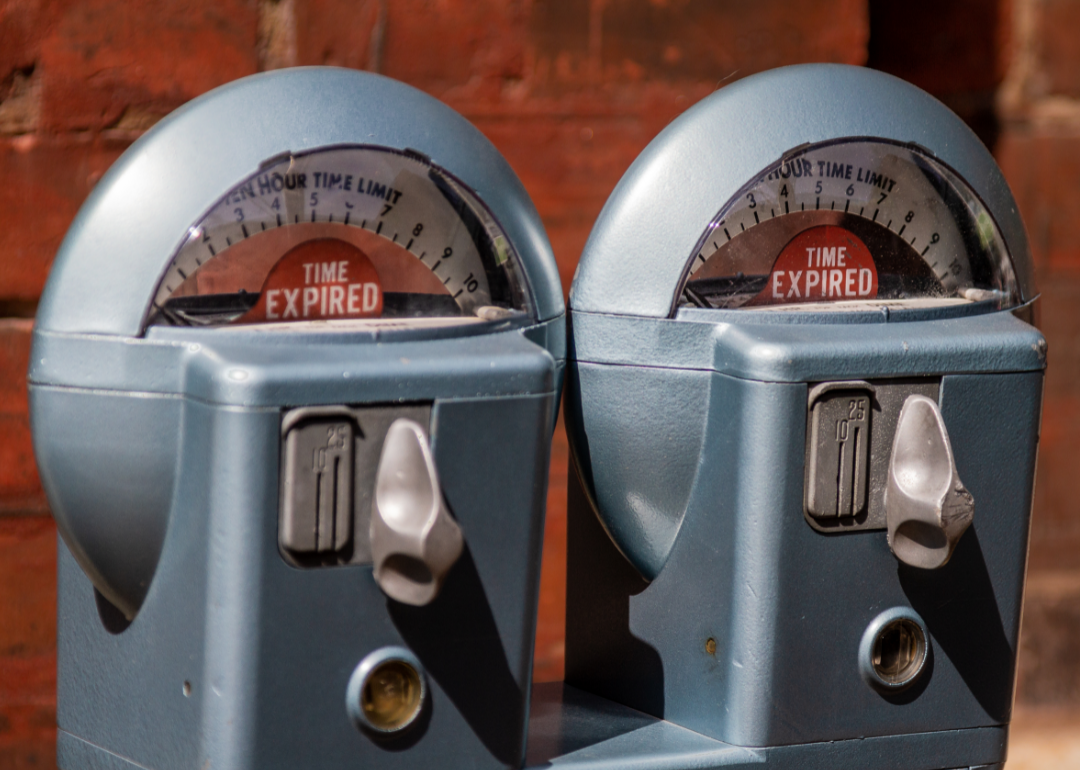 Close up of two coin-operated parking meters.