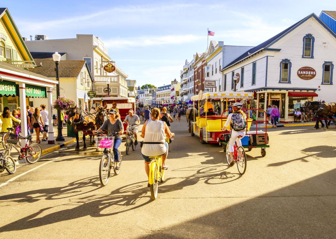 People riding bicycles on busy Market Street.