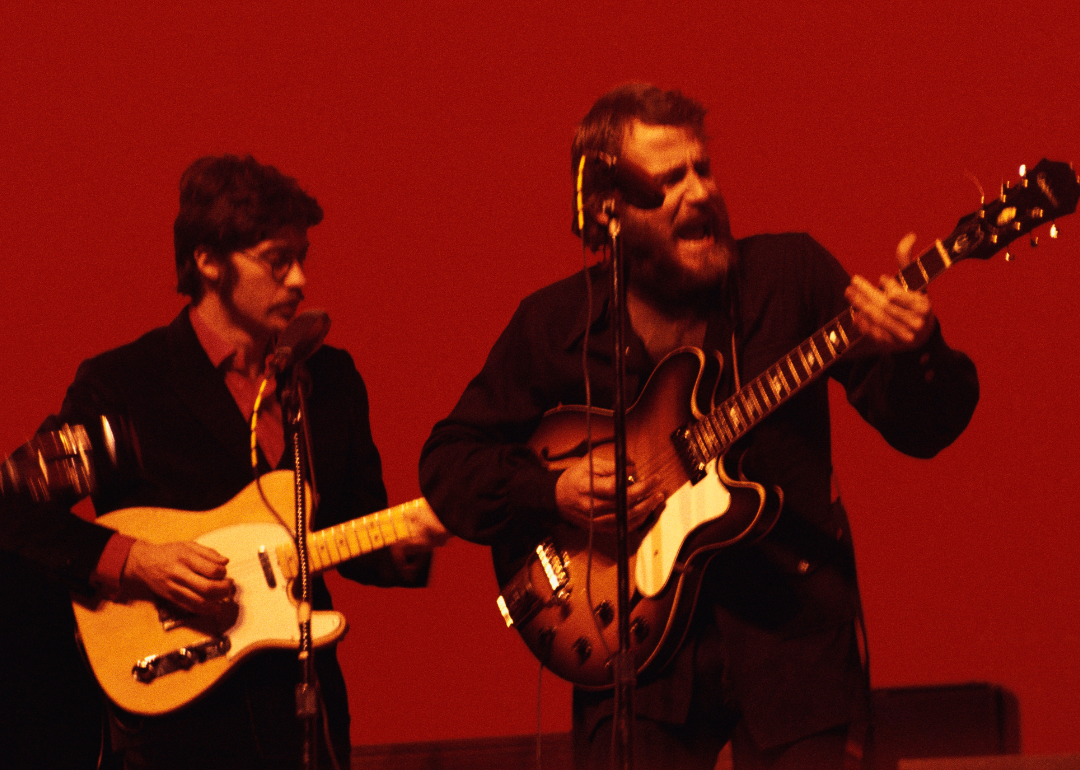 Robbie Robertson and Levon Helm performing live.