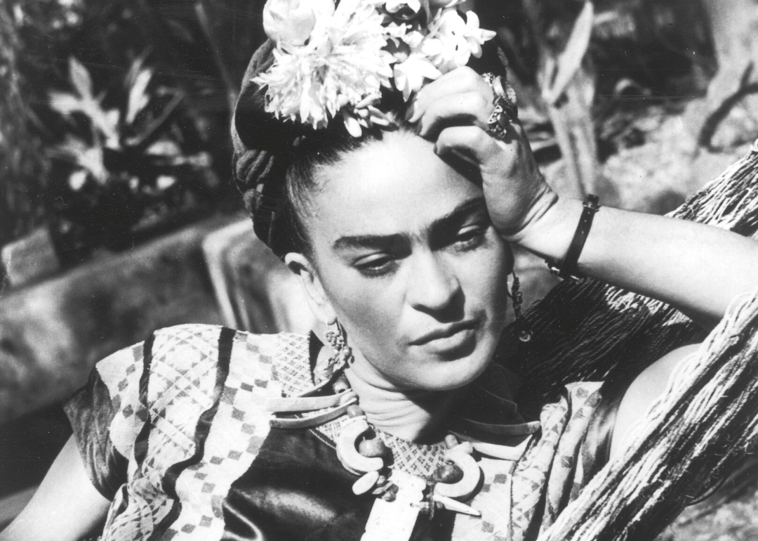 A portrait of Frida Kahlo in her garden.