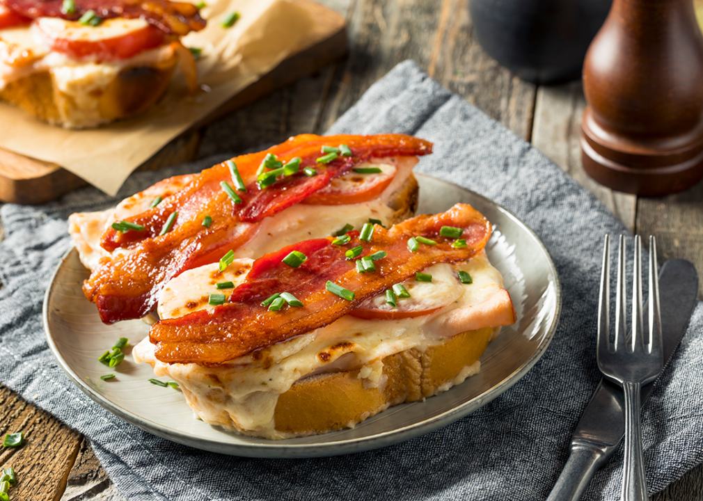 Hot brown with bacon, chicken and cream sauce.