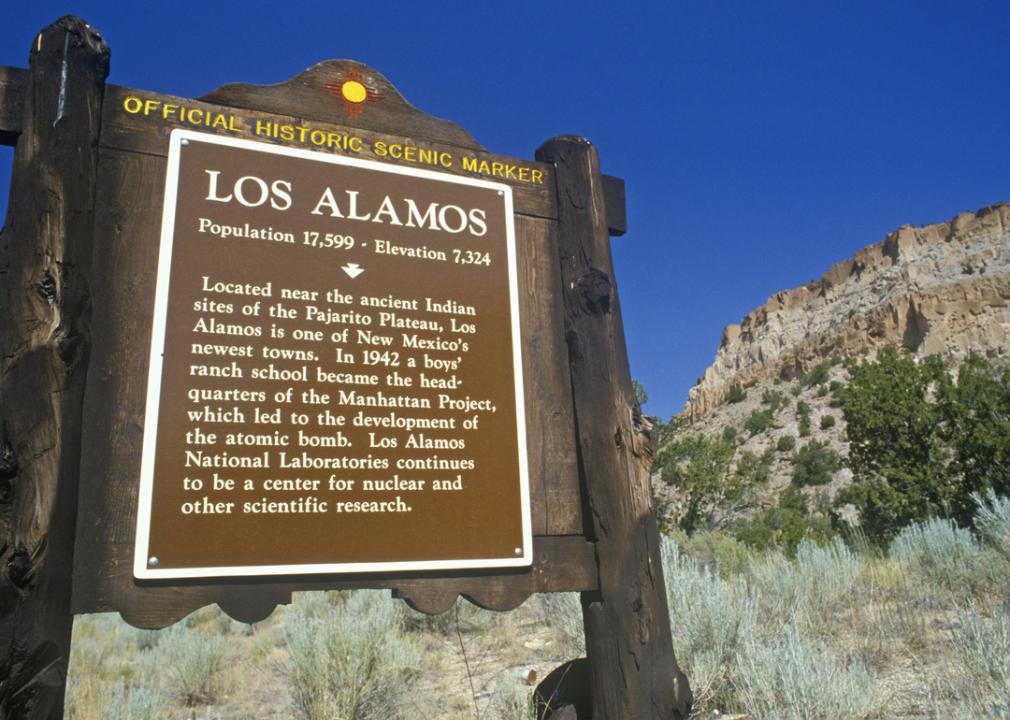 An official historic scenic marker sign for Los Alamos. 