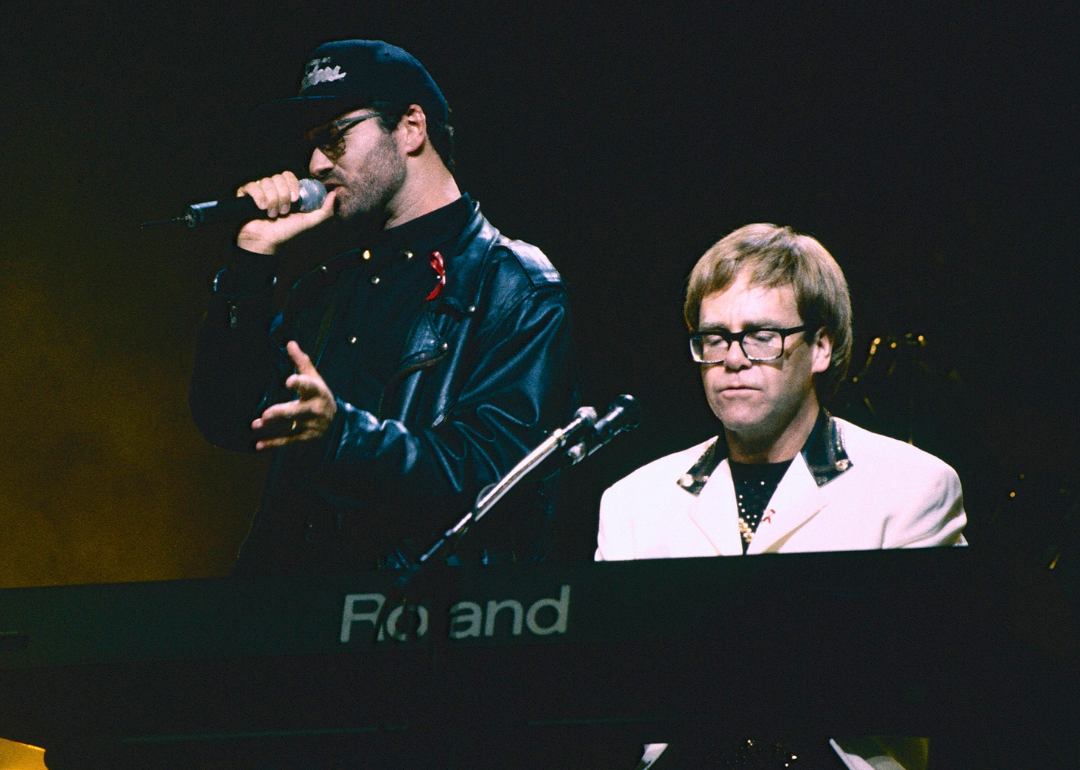 George Michael and Elton John perform onstage during AIDS benefit concert.
