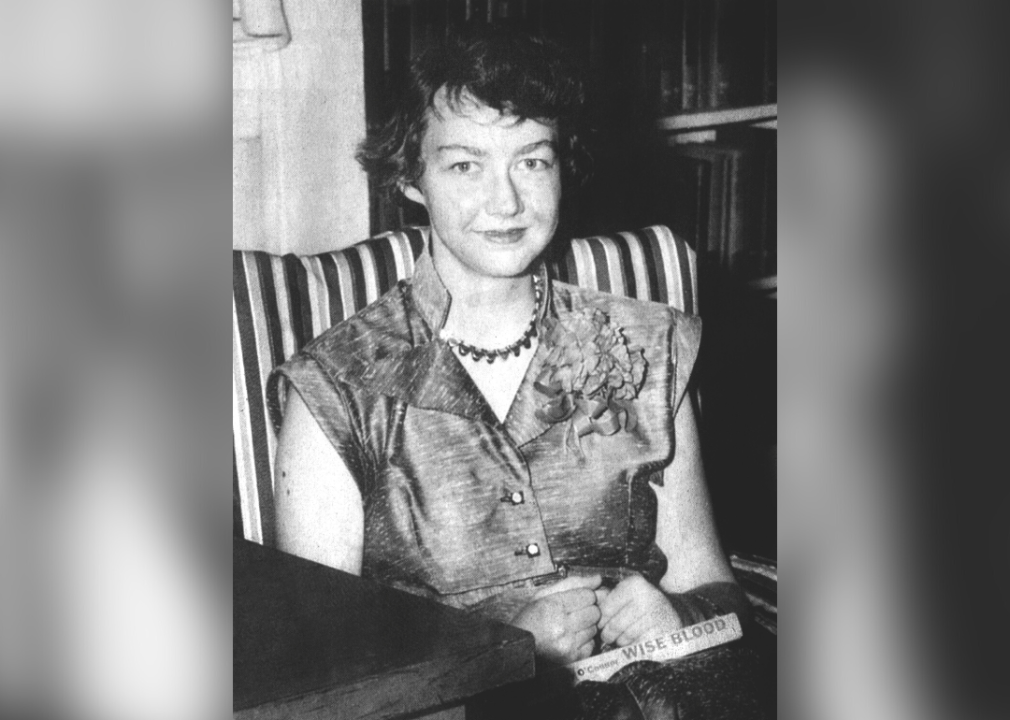 Flannery O'Connor poses with book
