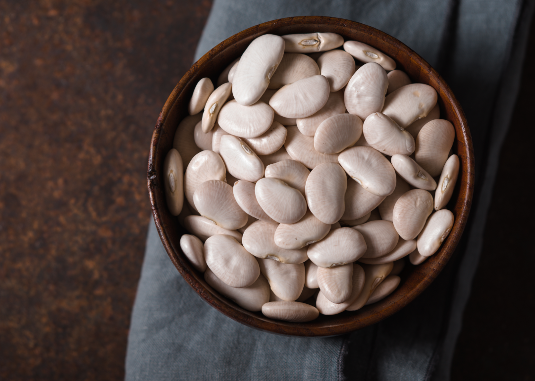 Bowl of large white beans uncooked.