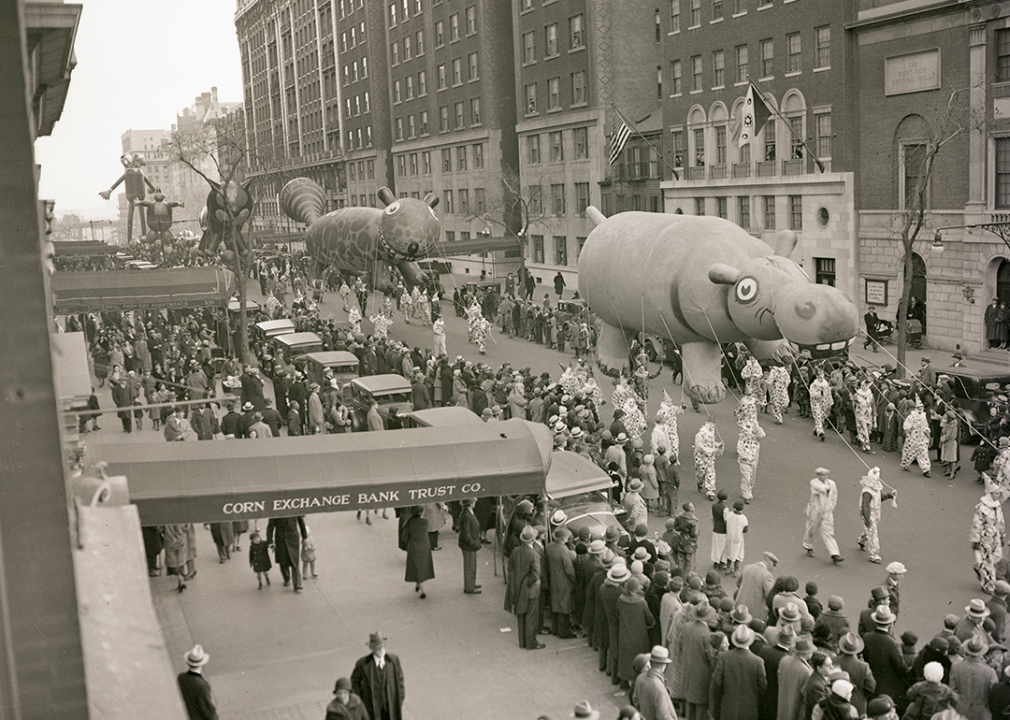 A hippopotamus balloon makes it way down Broadway, followed by a squirrel, and other balloons.