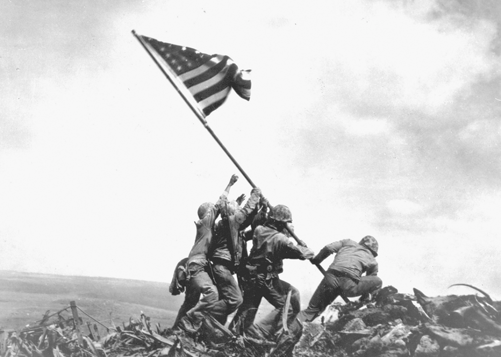 Marines raise an American flag on Mount Suribachi during the Battle of Iwo Jima.