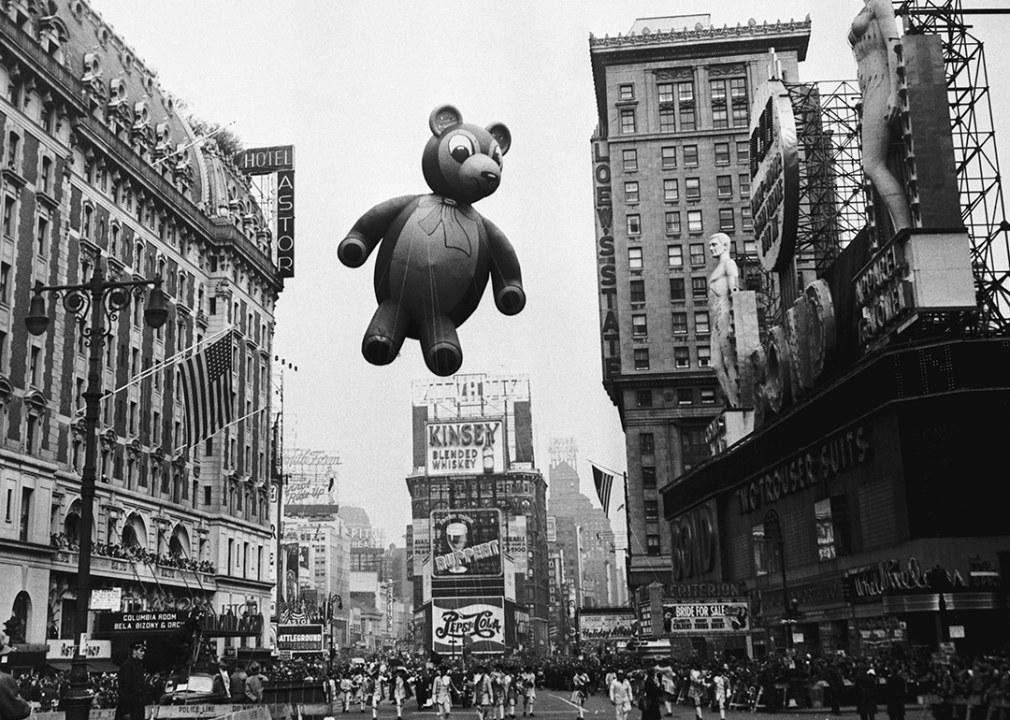 A Teddy Bear balloon floats over Times Square.