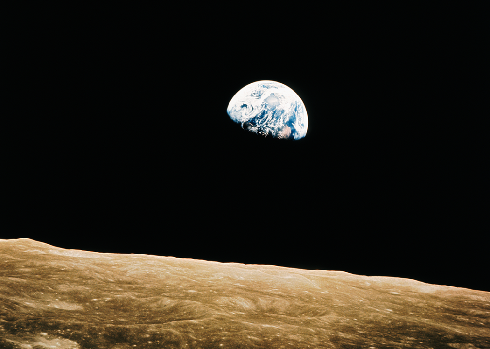 Earth above moon’s surface.