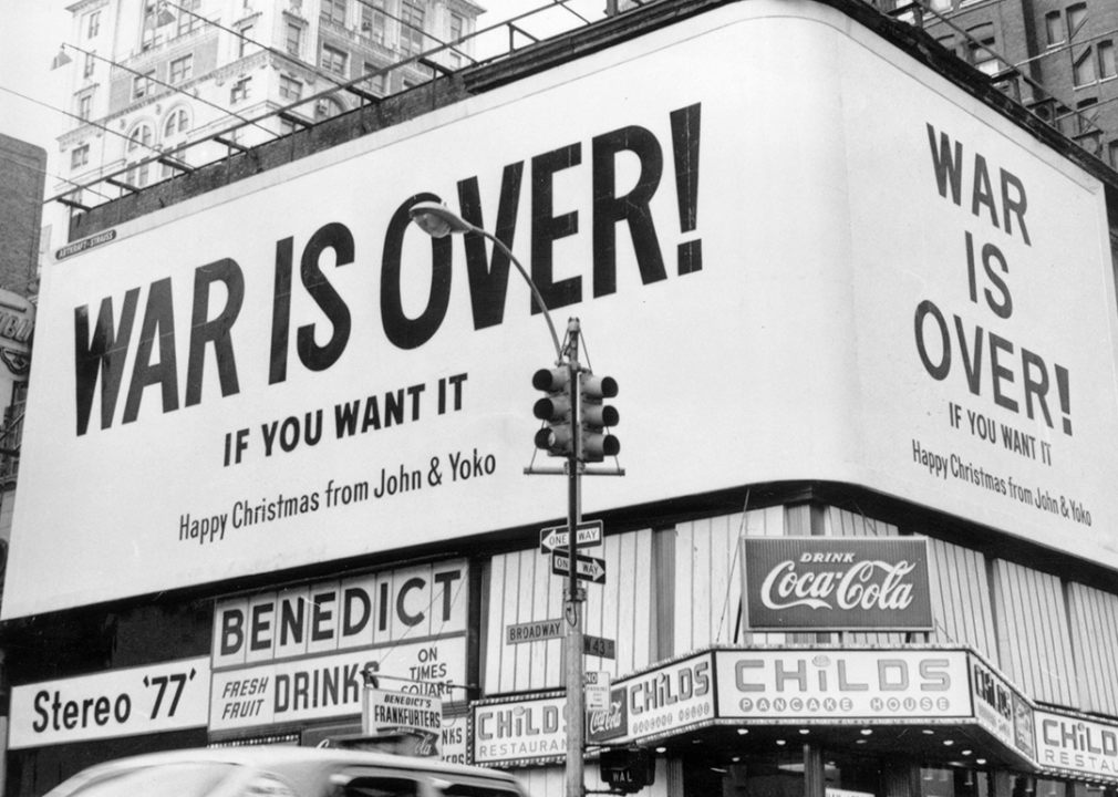 A large Christmas peace message reading 'War Is Over !' from John Lennon and Yoko Ono on a billboard in New York City.