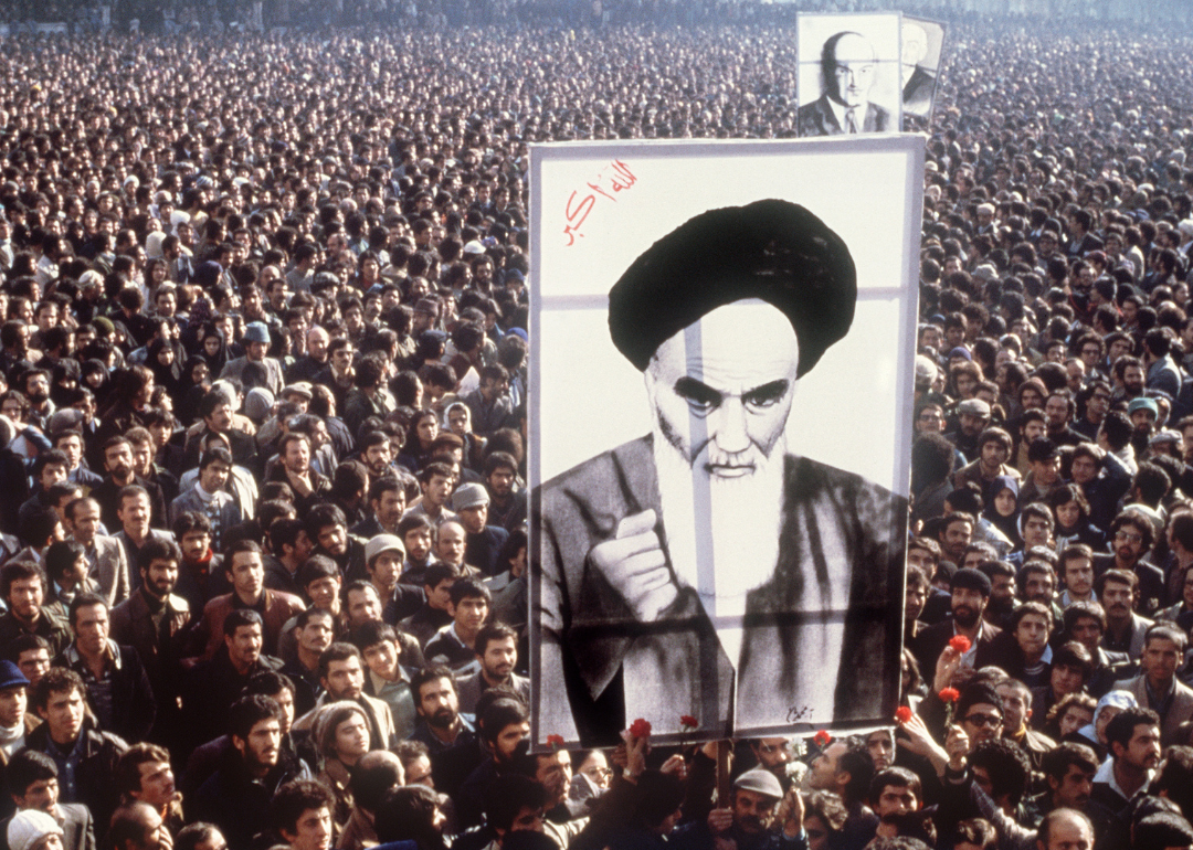Demonstrators hold a poster of Ayatollah Khomeini in Tehran.