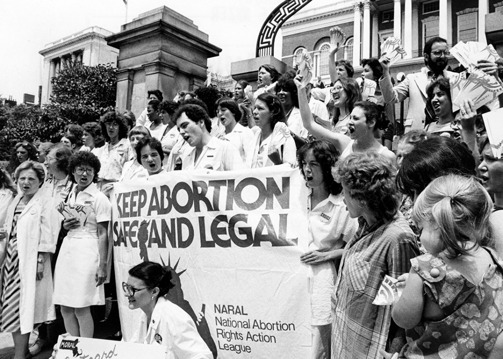 Demonstrators stand on the Massachusetts State House steps during a pro-choice rally.
