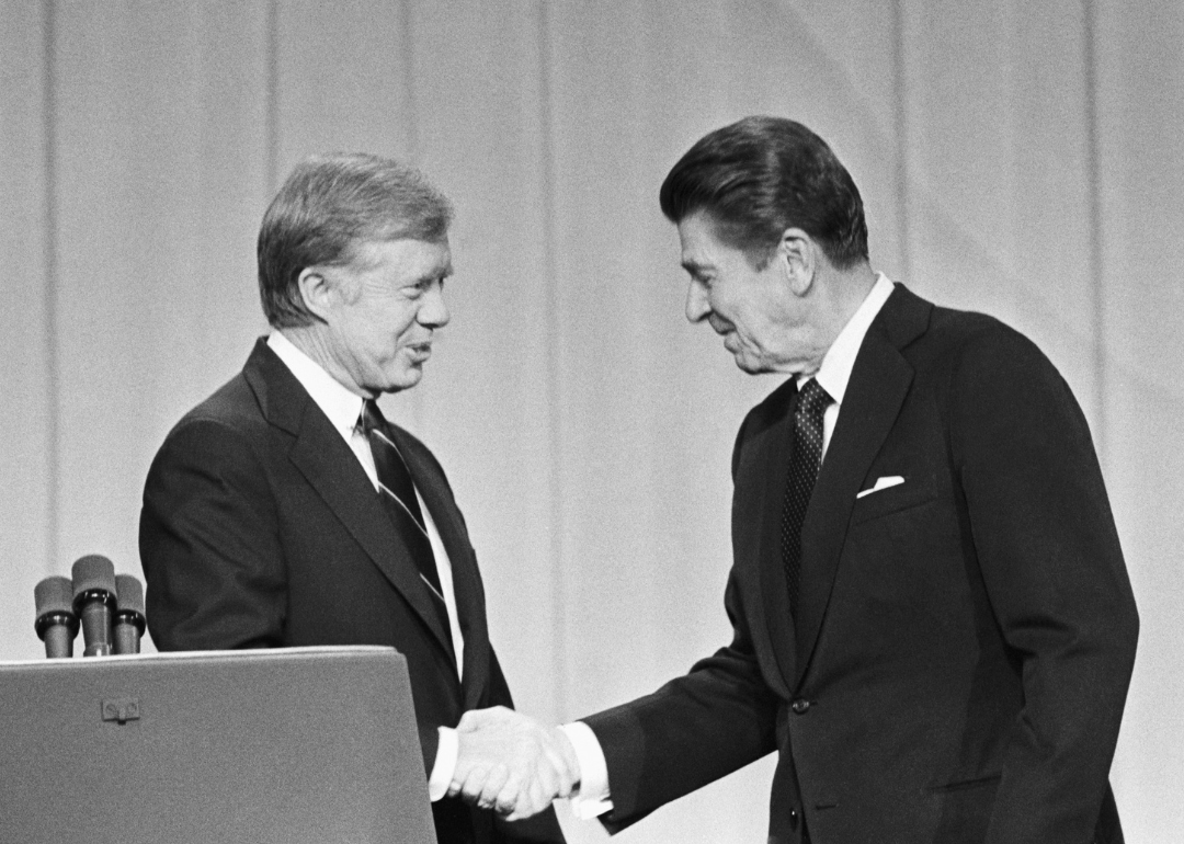 President Jimmy Carter and his Republican challenger, Ronald Reagan, shake hands before their debate.