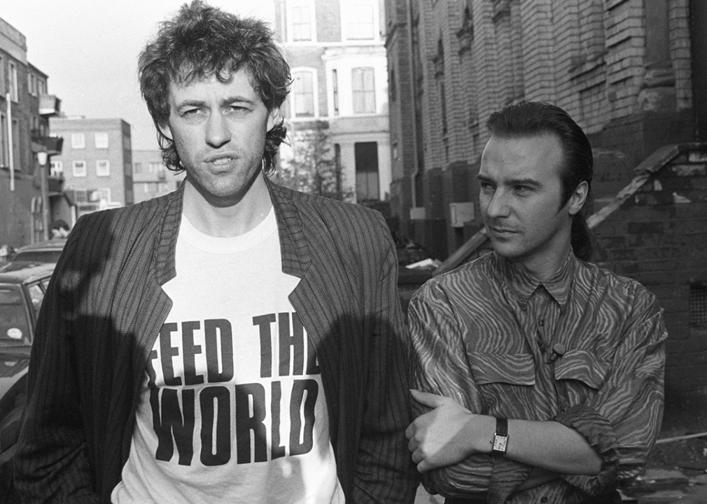 Bob Geldof wearing a Feed the World t-shirt poses with Midge Ure during the recording of Do They Know It's Christmas?