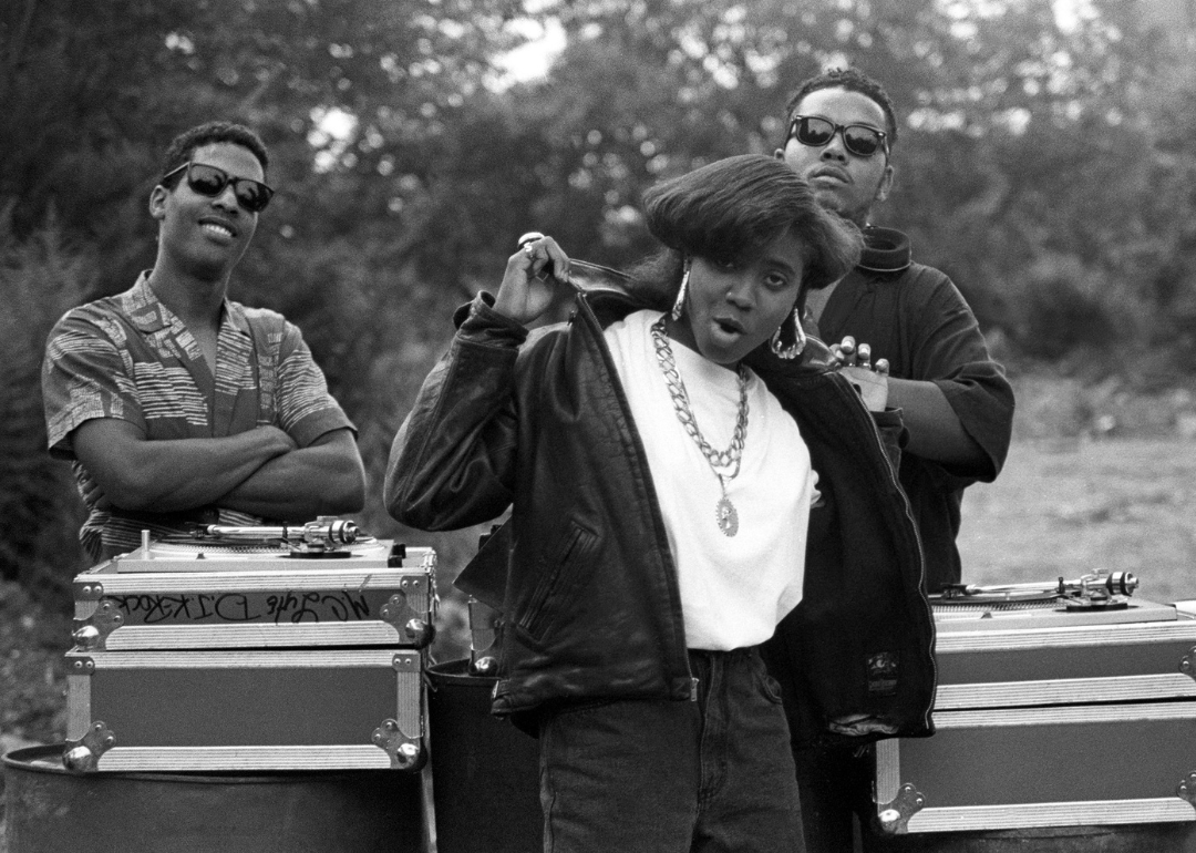 MC Lyte with Master Te and K-Rock pose during a video shoot.