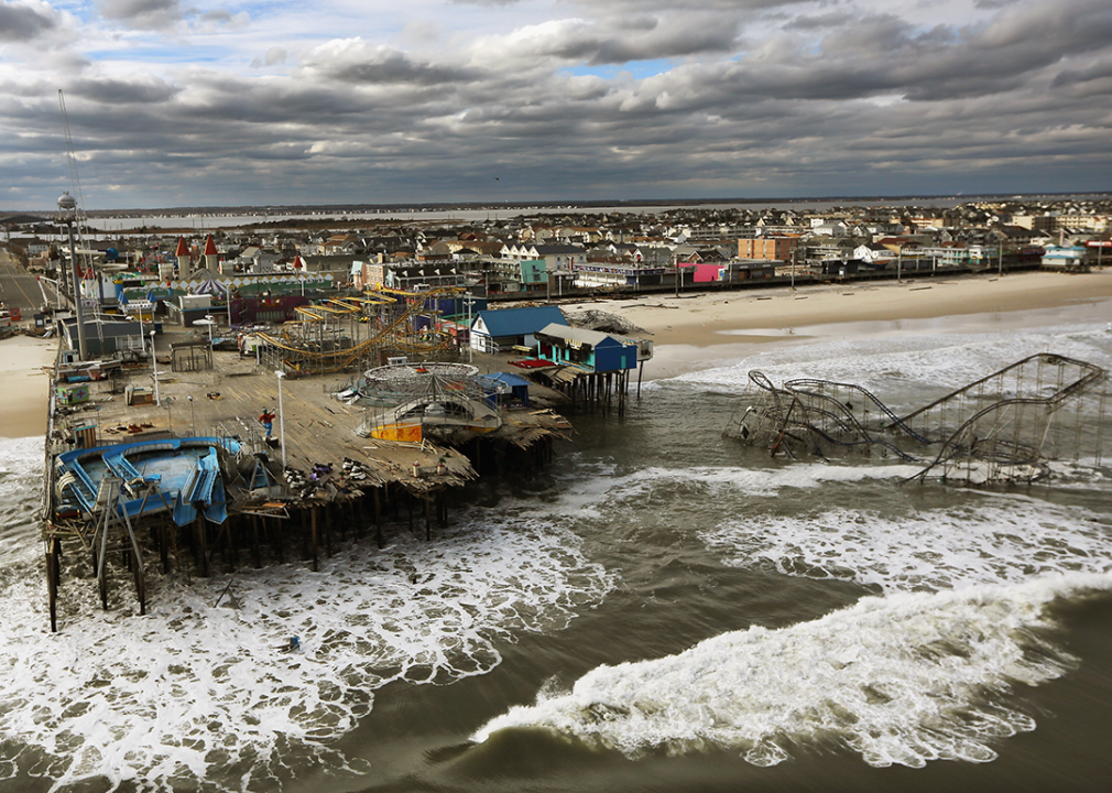 Waves break in front of a destroyed amusement park wrecked by Hurricane Sandy in Seaside Heights, New Jersey.