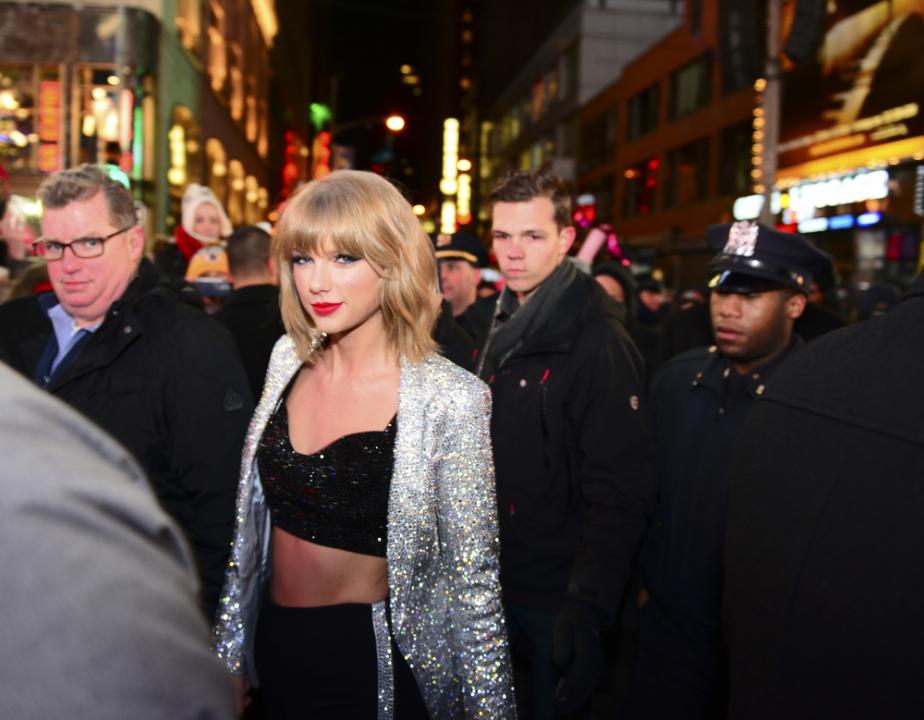 Taylor swift in silver jacket