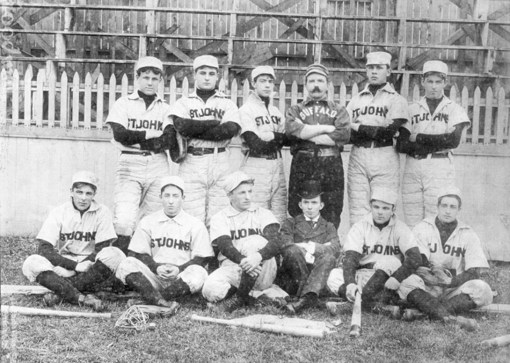 Members of the St John baseball team pose on a field, circa 1895