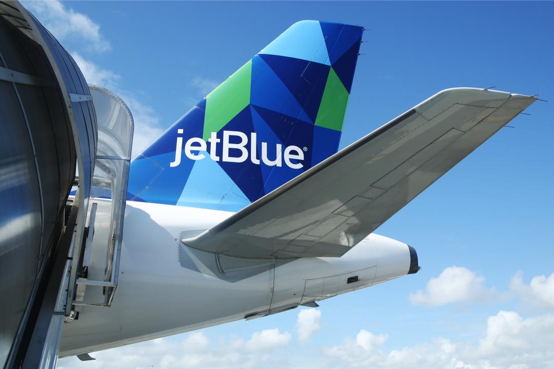A JetBlue airplane awaits boarding