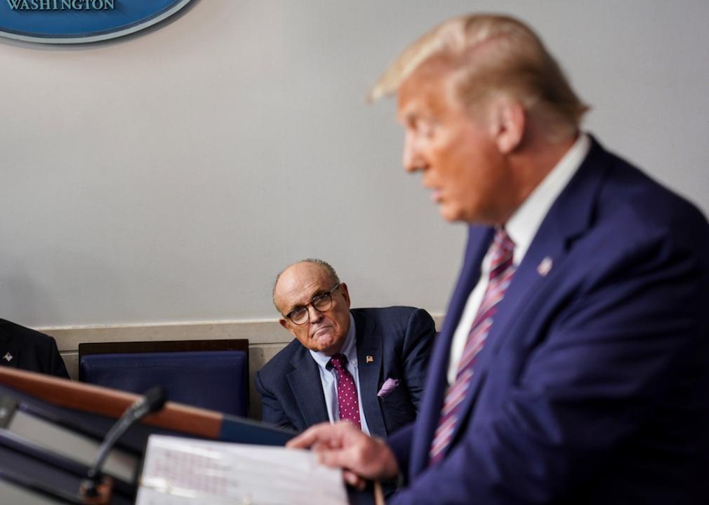 Former New York Mayor Rudy Giuliani listens as former President Donald Trump speaks during a news conference in the Briefing Room of the White House in 2020.