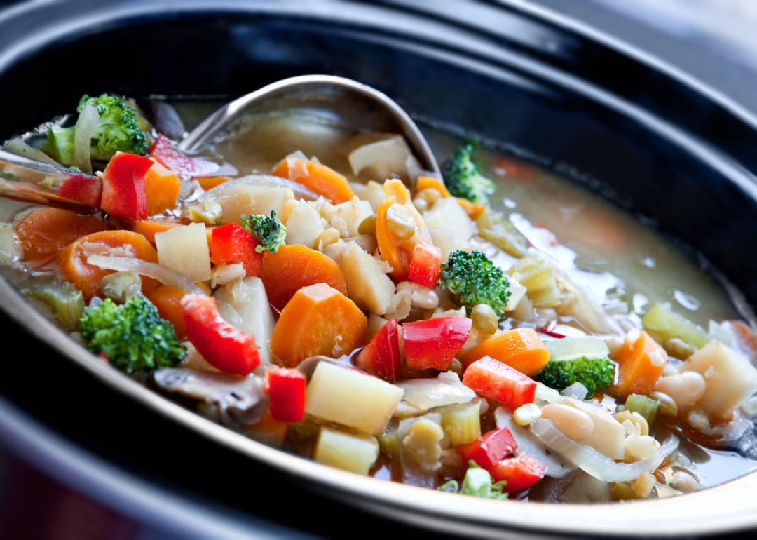 Vegetable soup, slow-cooked in a crock pot, ready to serve