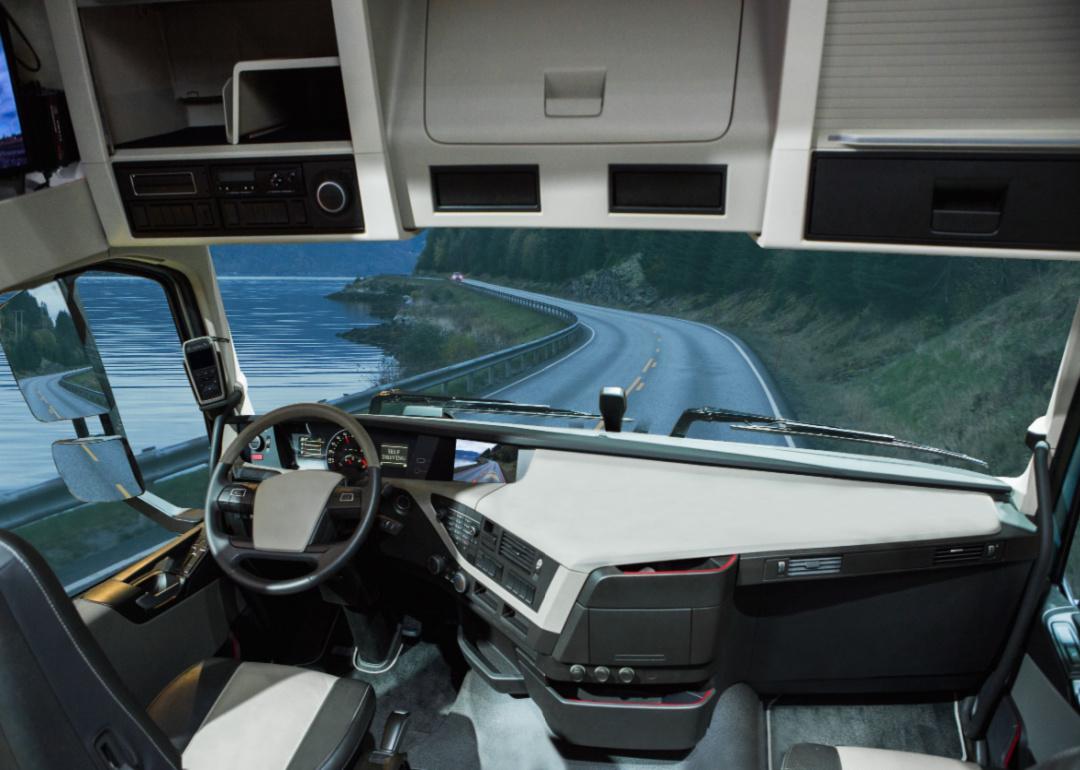 Interior perspective of a self-driving truck on the road with no driver