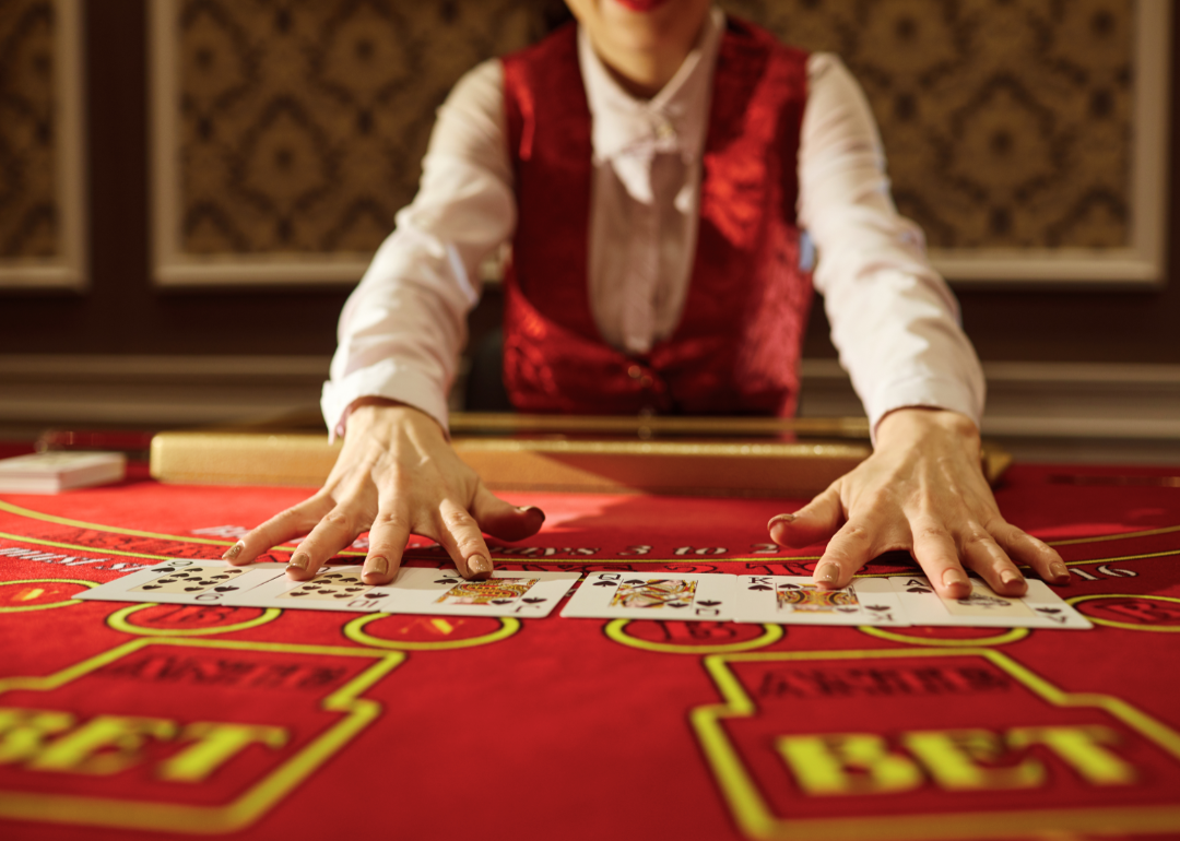 A dealer at a casino dealing cards