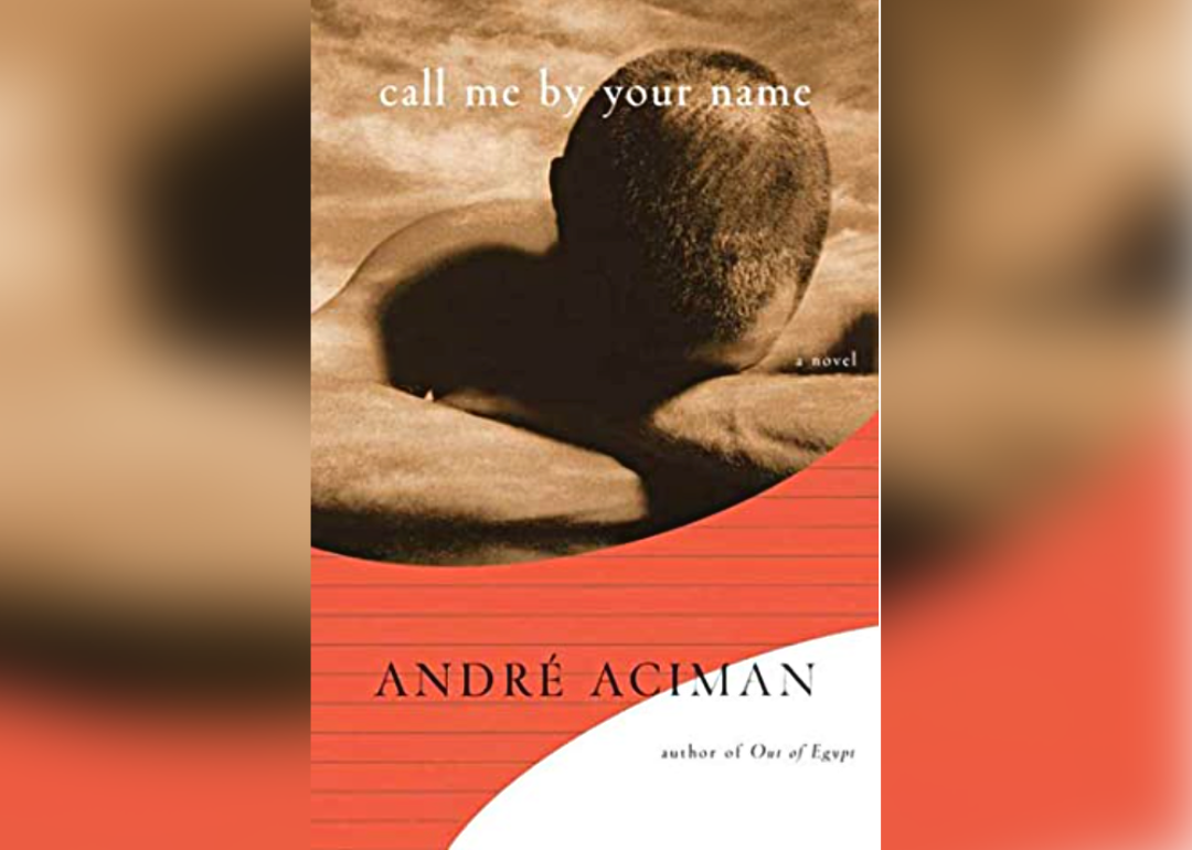 The orange, gold and white cover of Call Me by Your Name