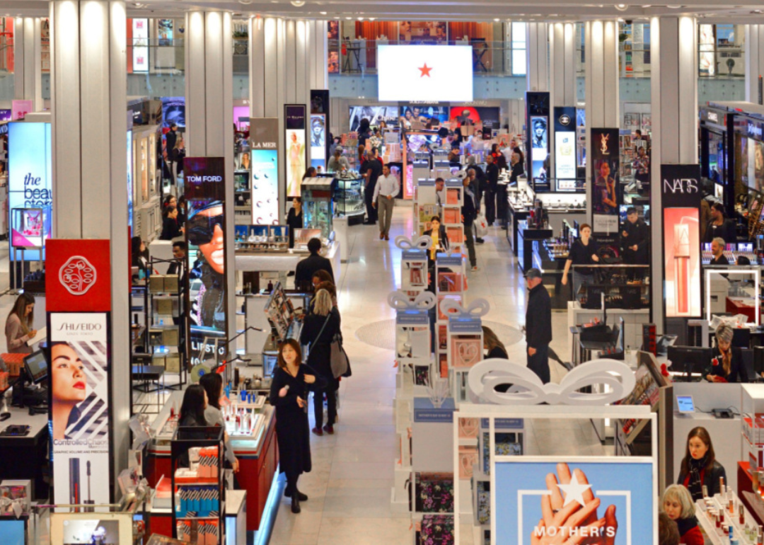Wide view of customers shopping in a department store.