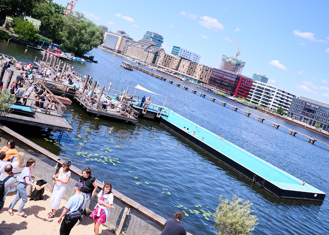 The Badeschiff swimming pool made of a shipping container floating in the river Spree in Berlin.