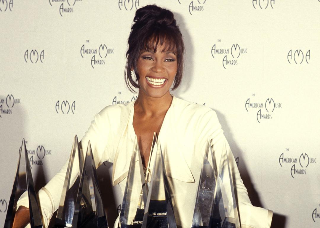 Whitney Houston poses with American Music Awards.