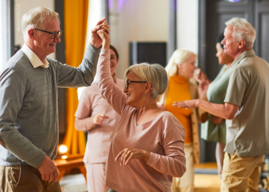 Group of smiling senior people dancing.