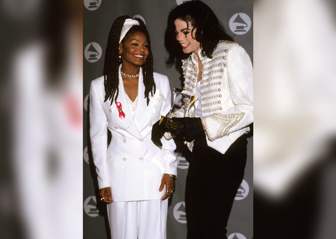 Janet Jackson in a white suit backstage at the Grammys with Michael Jackson.