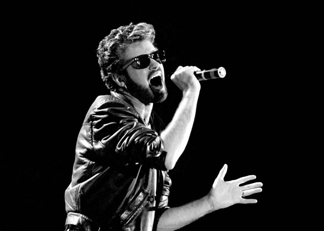 George Michael performs onstage at Live Aid.