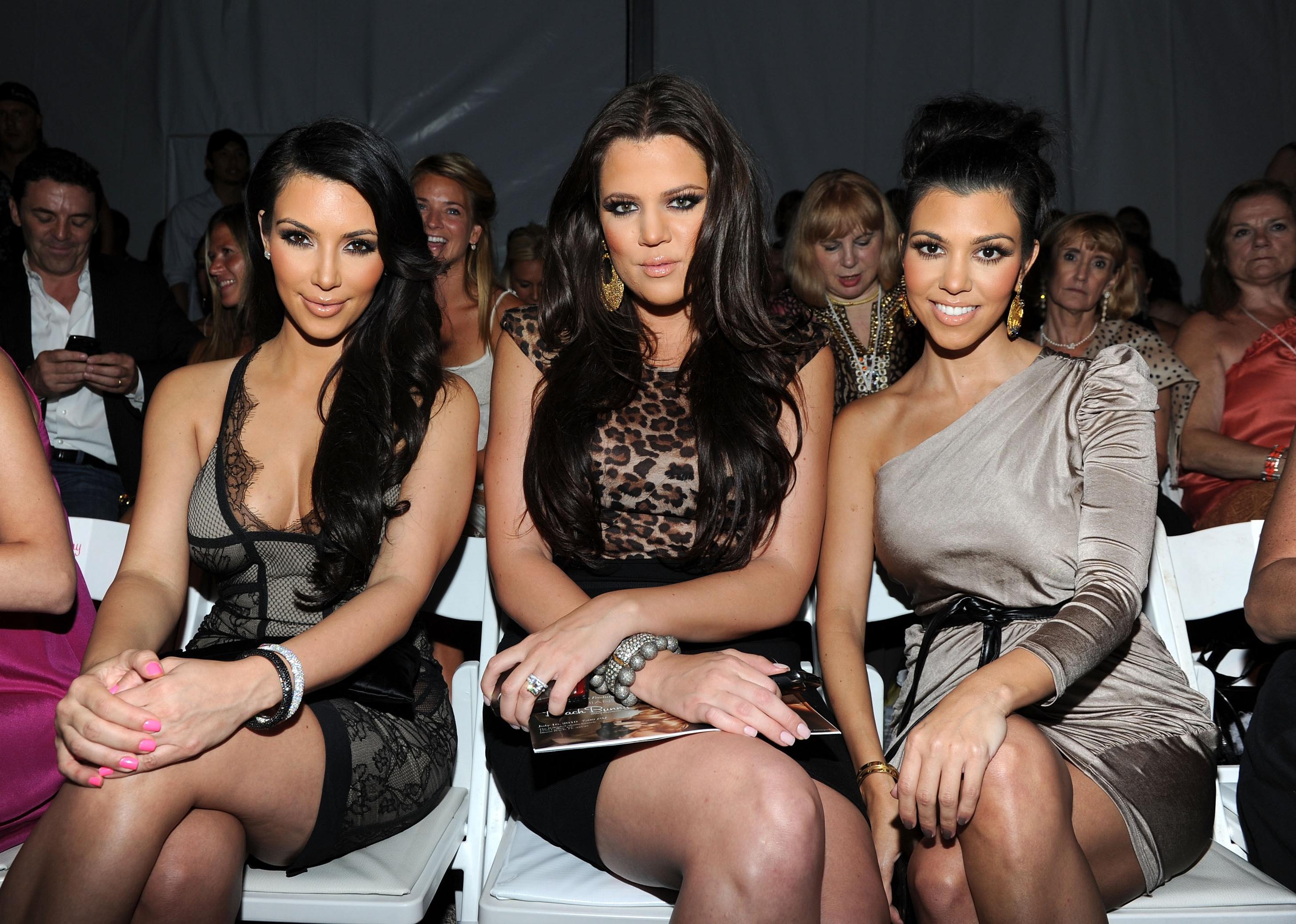 Kim Kardashian, Khloe Kardashian and Kourtney Kardashian attend the Beach Bunny Swimwear 2011 fashion show.
