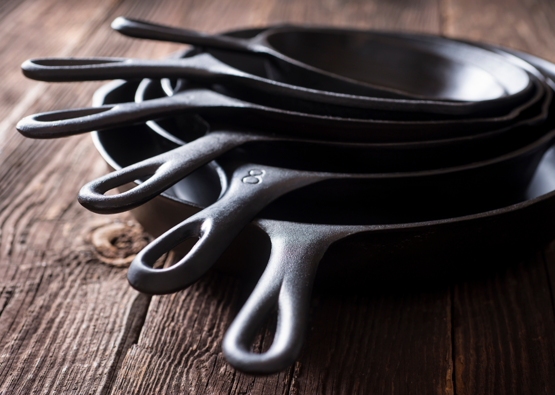 A stack of cast iron skillets.