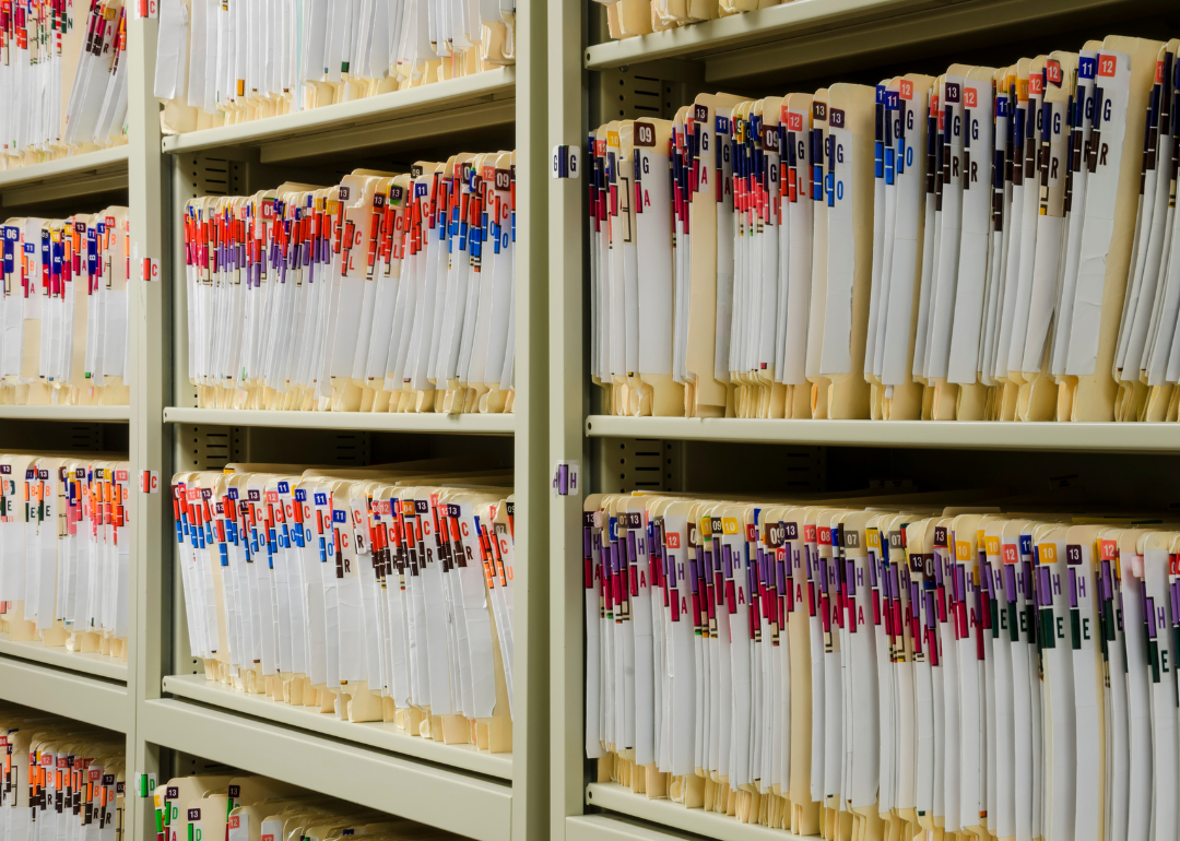 Medical files on shelves in storage.