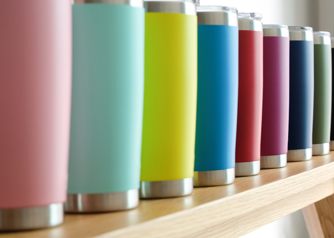 A row of colorful stainless steel water bottles.