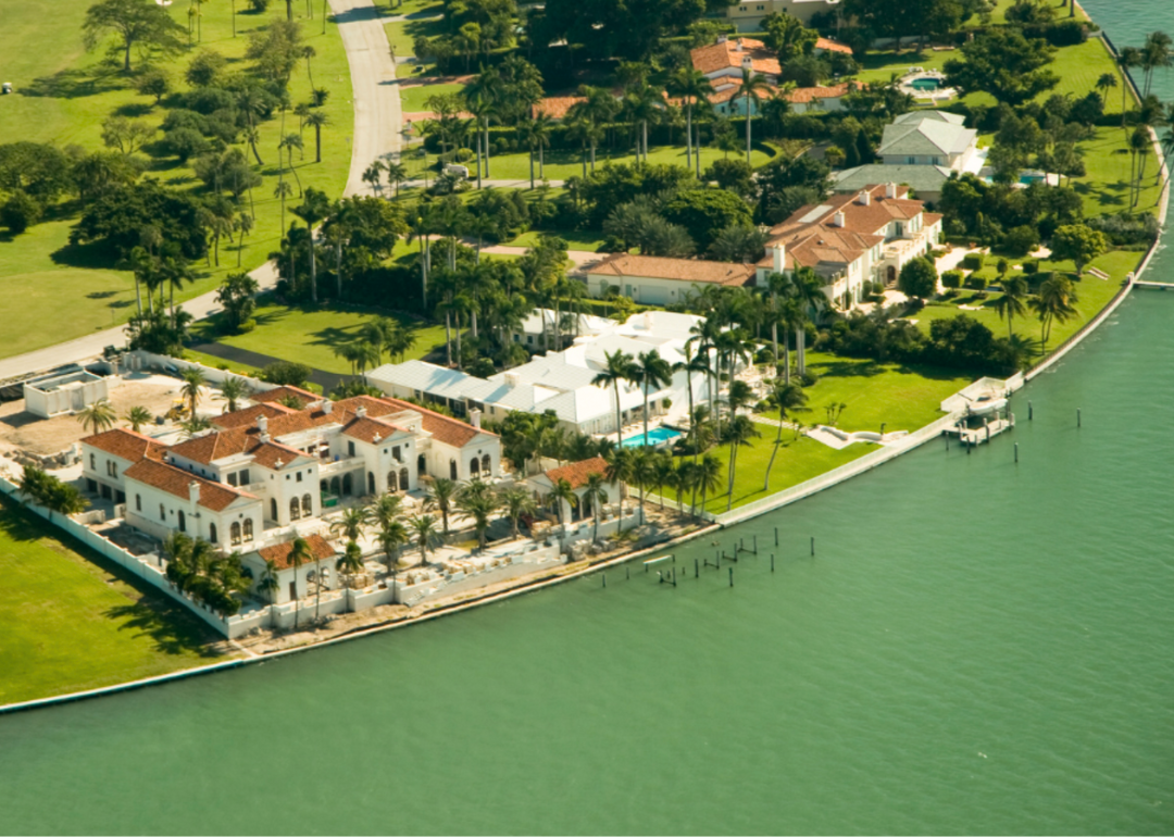 An aerial view of luxury homes on the water in Miami.