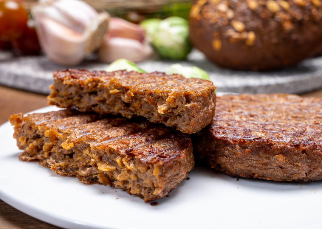 Cooked veggie burgers on a plate.