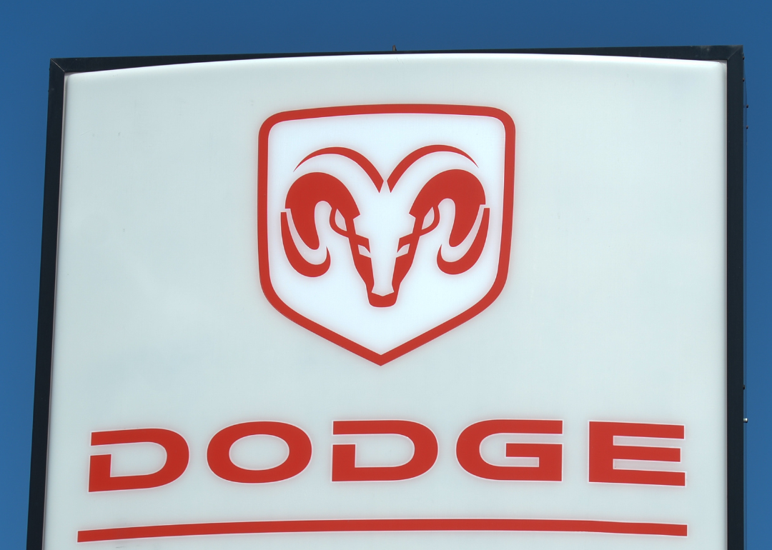 Dodge logo on a sign at a car dealership.