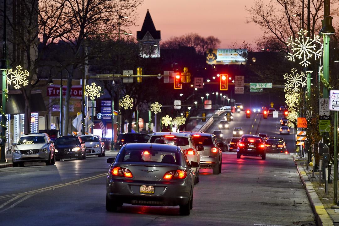 Cars on the 300 block of Penn Street looking West towards the Penn Street Bridge on Thursday, December 10, 2020, at dusk.
