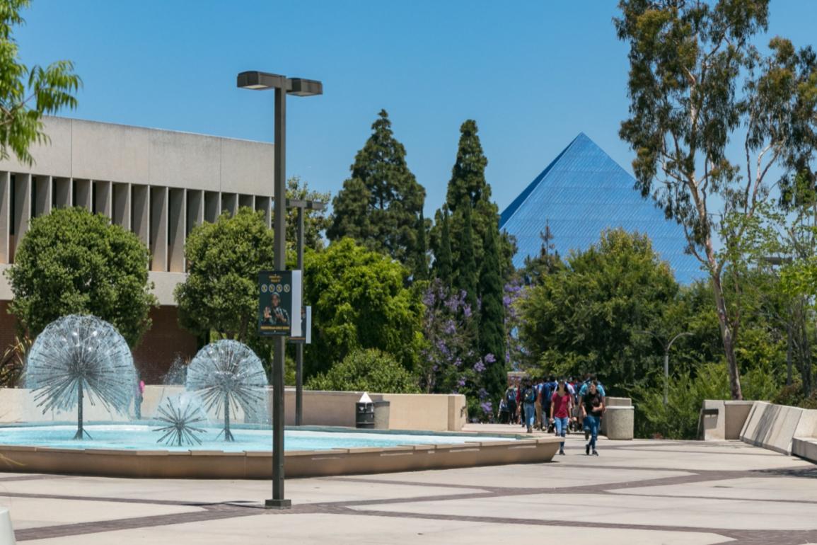 Students congregate by the fountains outside of the University of California, Long Beach.